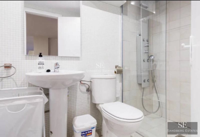 Exterior view of a modern luxury home with reflecting pool. Minimalist design featuring large windows and lush gardens.