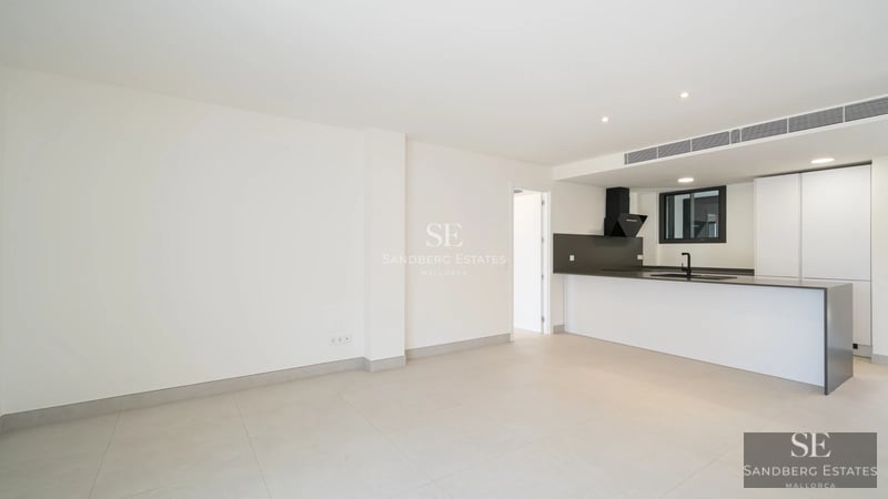 Bright, spacious living room with balcony, sea view. Modern design, neutral color palette, high-quality finishes.