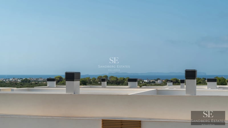 Spacious living room with sea view, large windows, modern design, expansive terrace, and high-end furniture.