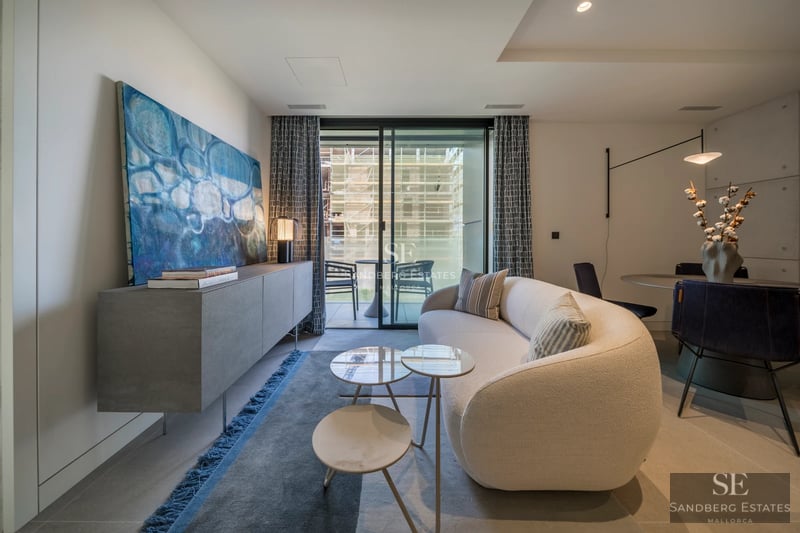 Exterior of a modern villa featuring a pool, terraces, and large windows. Sleek design with clean lines and lush landscaping.