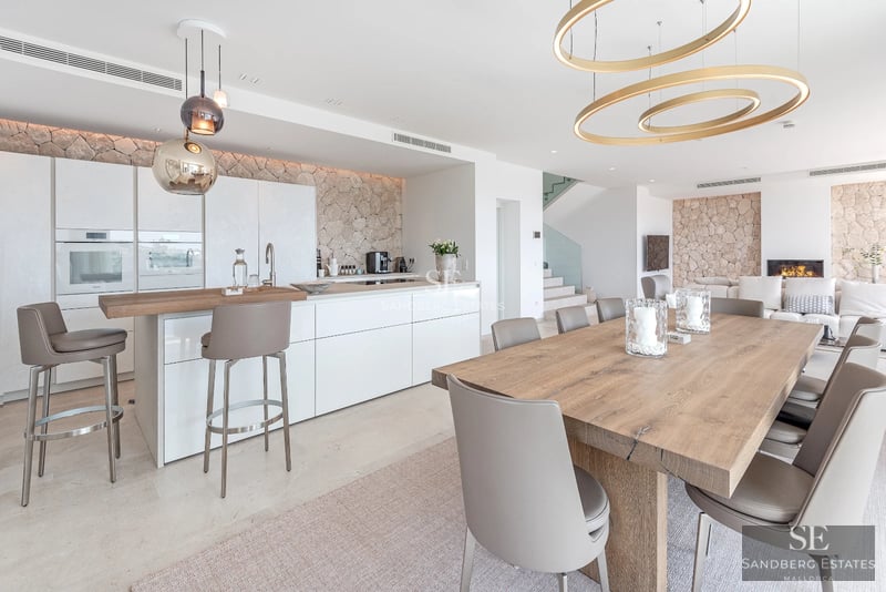 Exterior of modern villa with infinity pool, lush greenery, and minimalist architecture. Open spaces and natural light.