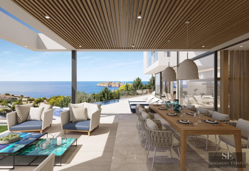 Exterior view of a modern villa featuring a reflecting pool, lush garden, and spacious outdoor living areas.