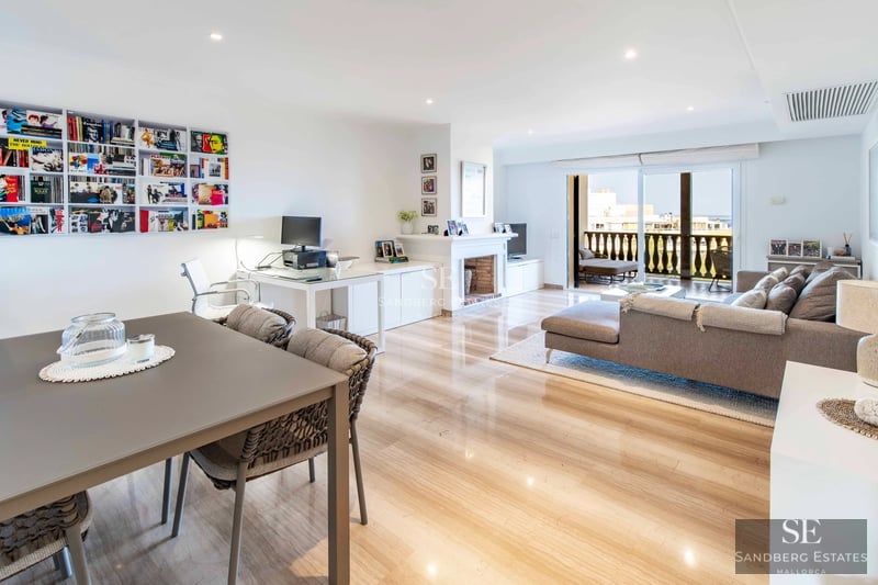 Spacious terrace with pool, sun loungers and panoramic views. Modern design with wooden floors and elegant furniture.