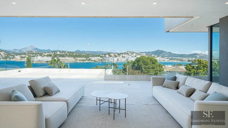 Exterior view of a modern villa featuring a pool, lush garden, and minimalist architecture. Natural lighting and high-quality finishes.