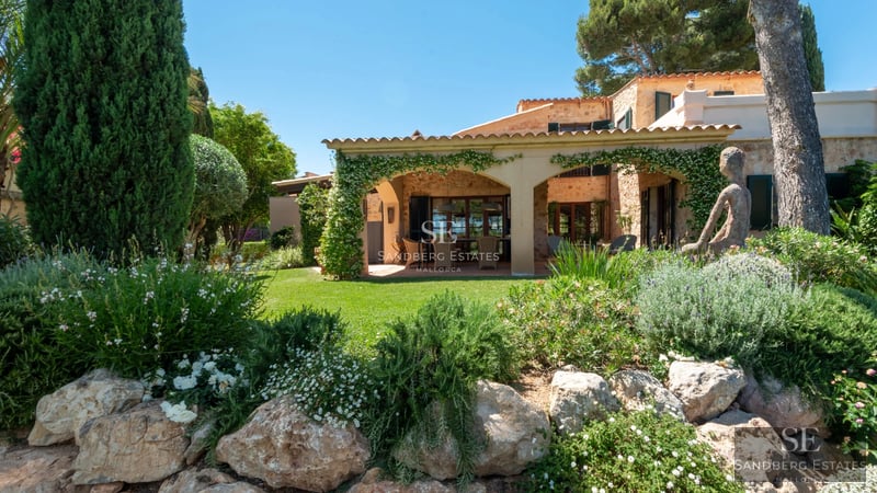 Spacious living room with panoramic windows, modern fireplace, and minimalist decor. Expansive views, abundant natural light.