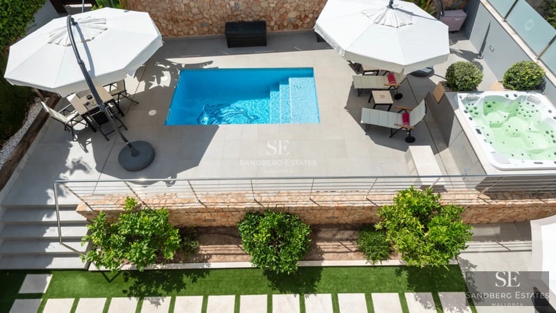 Modern interior with balcony and panoramic sea views. Elegant design, high-end furnishings, and abundant natural light.