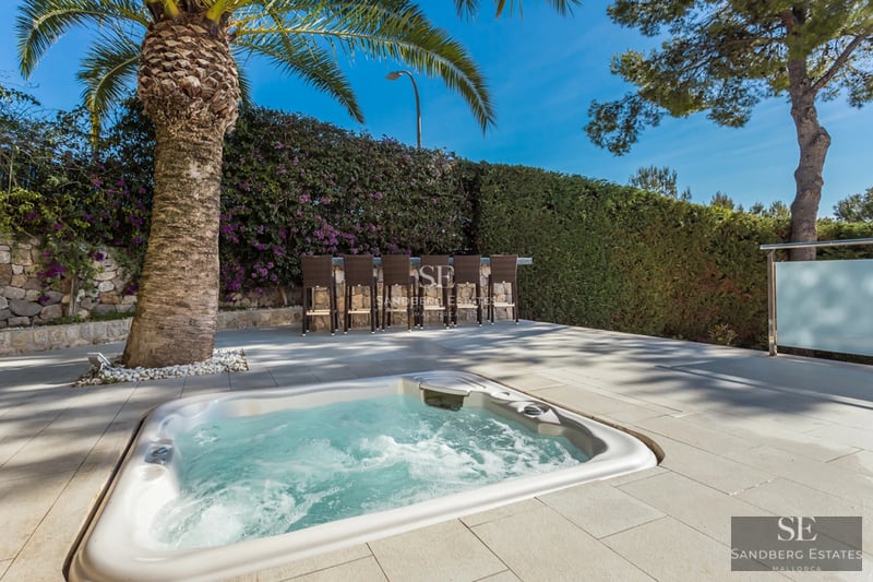 Spacious terrace with infinity pool, sun loungers, and panoramic views. Modern architecture, clean lines, and abundant natural light.