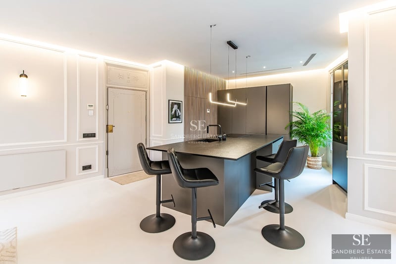 Expansive terrace with infinity pool and panoramic views. Modern design, glass railings, stylish furniture, and lush vegetation.