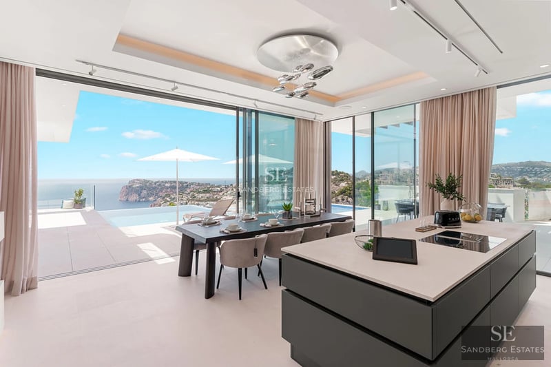 Spacious terrace with pool, sun loungers, and garden view. Modern design with wood and natural stone elements. Soft lighting.