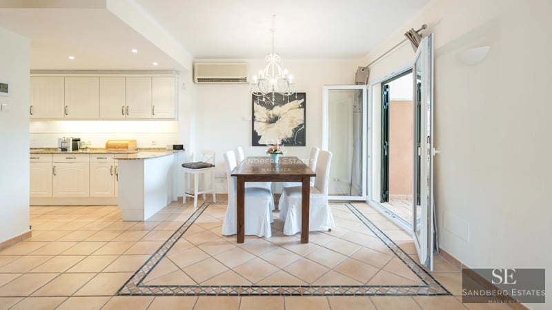 Expansive terrace with infinity pool. Panoramic sea views. Modern design with elegant outdoor furniture and lush vegetation.