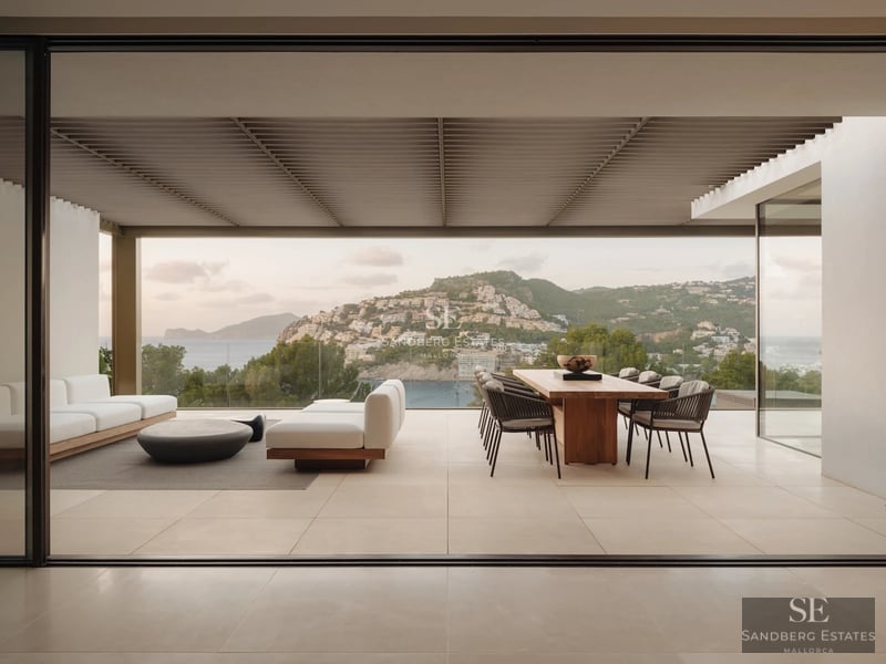 View of a luxury residence with reflecting pool, surrounded by lush greenery and an imposing modern architecture.