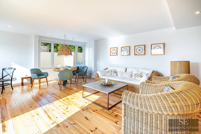 Exterior view of a modern villa with pool, garden, and terrace. Minimalist design featuring large windows and high-quality finishes.