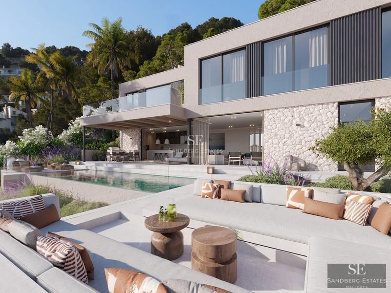 Infinity pool view with sun loungers, outdoor living area, and panoramic sea views. Modern design with clean lines and luxury finishes.