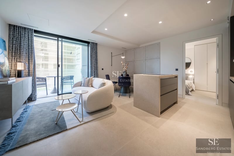 Large swimming pool surrounded by lush vegetation. Modern architecture with large windows and covered terrace. Luxurious and relaxing atmosphere.