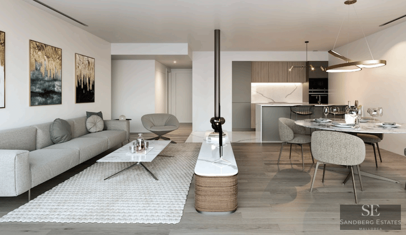 Modern open-plan living room with grey sofa, marble coffee table, and dining area with a view of a minimalist kitchen.