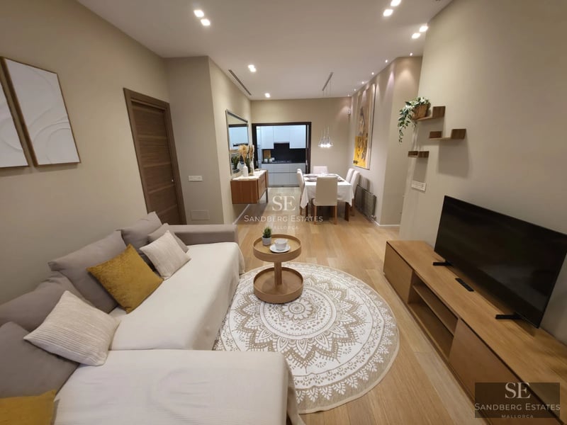 Exterior view of a modern villa featuring an infinity pool, expansive terraces, and lush garden. Minimalist architecture with large windows.