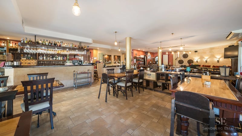 Expansive terrace featuring an infinity pool, sun loungers, and panoramic ocean views. Modern and elegant architecture.