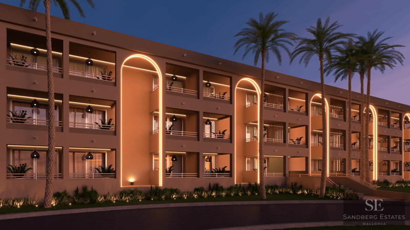 Modern multi-story building facade at twilight featuring glowing orange LED arches and palm trees.