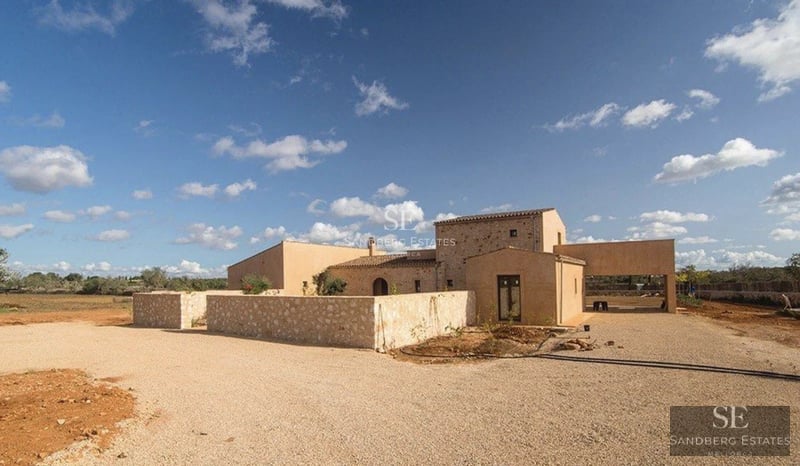 Spacious terrace with infinity pool, modern furniture, panoramic sea views, and minimalist architectural design.