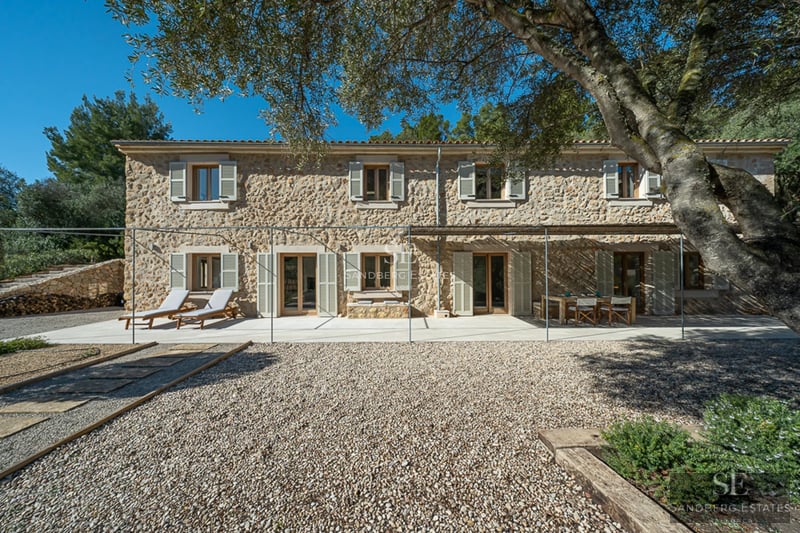 Spacious terrace with pool and seating area. Modern, minimalist architecture. Garden views. Ideal for relaxation and entertainment.