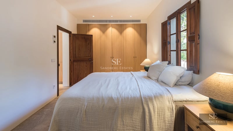 Modern interior with balcony and panoramic sea views. Stylish furniture, natural light, and minimalist design.