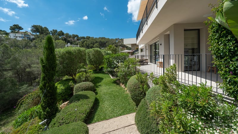 Exterior view of a modern villa with infinity pool. Large windows, minimalist design, and lush tropical garden.