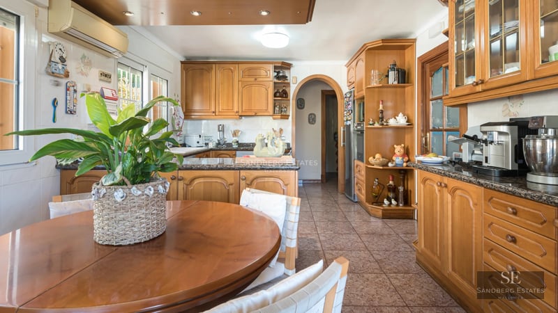 Exterior view of a modern villa with reflective pool. Minimalist design, large windows, and impeccable landscaping.