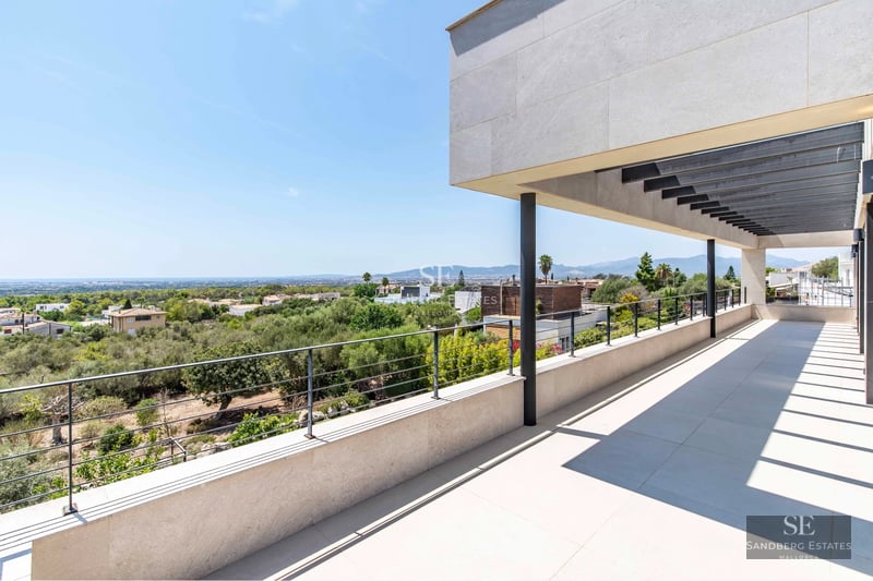 Exterior view of a modern villa with pool, terrace, and garden. Minimalist architecture featuring large windows and elegant design.