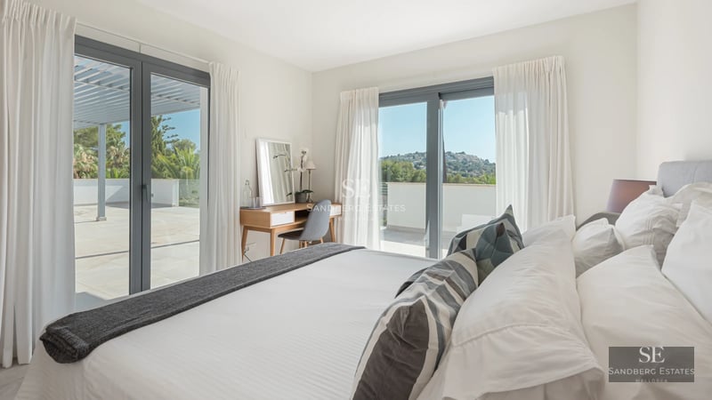 Panoramic view of a modern villa with infinity pool. Minimalist design, large windows, and high-quality finishes.