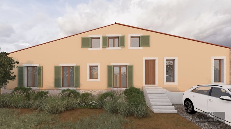 Front exterior of a peach-colored Mediterranean house with green shutters, stone steps, and a white car in the driveway.