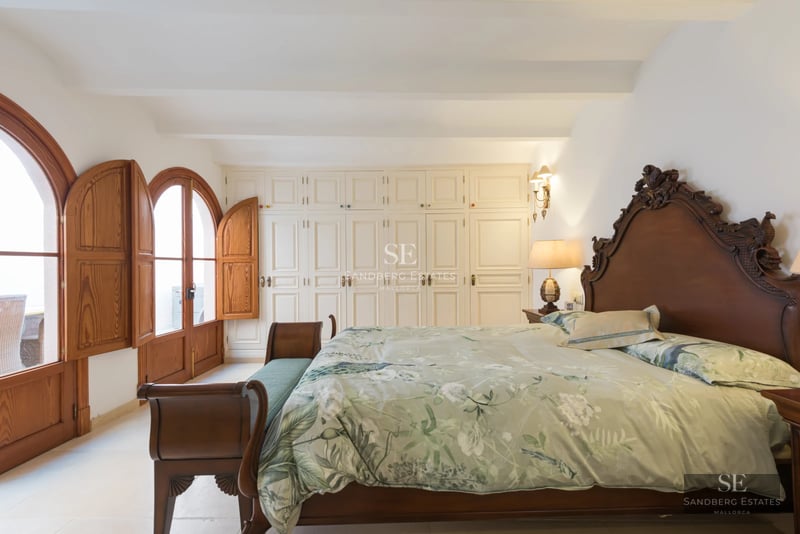 Bright living room with large windows, outdoor pool, modern design, elegant furniture, and neutral color palette. Open and inviting space.