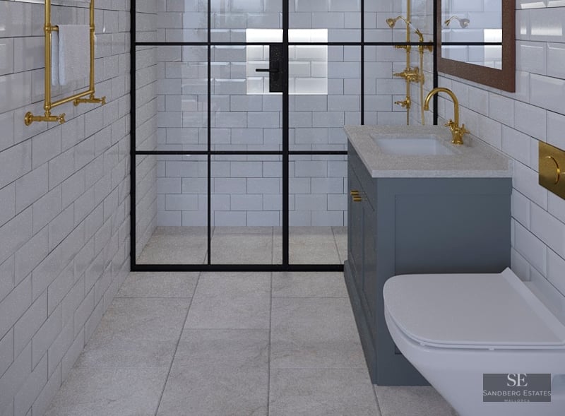 Modern bathroom featuring white subway tiles, a black-framed glass shower, and elegant gold faucets and fixtures.