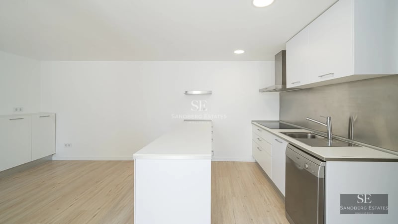 Modern facade with pool. Large windows, natural stone, minimalist landscaping, and a bright blue swimming pool.