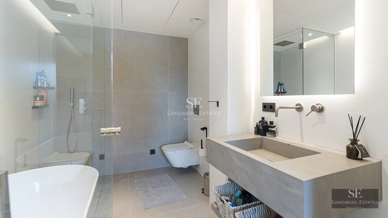 Exterior of modern villa with pool, large windows, and lush garden. Minimalist and elegant architectural design.