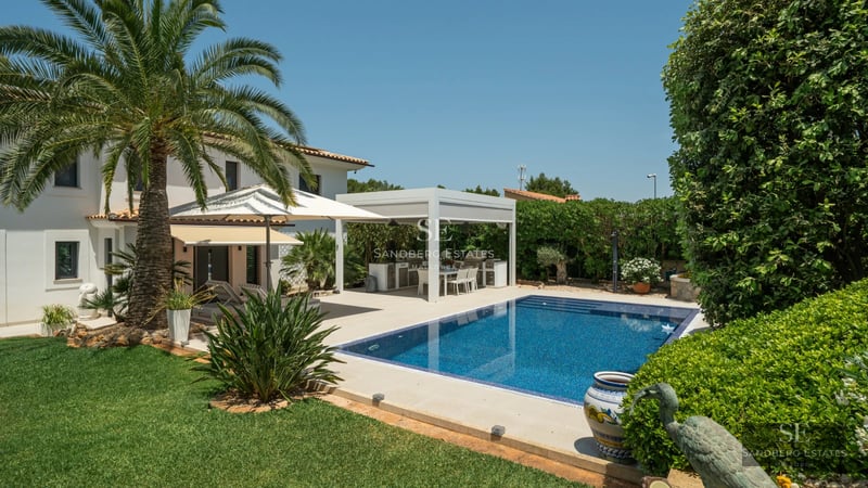 Panoramic view of a modern villa with pool, elegant design, large windows and lush gardens. Contemporary architecture.