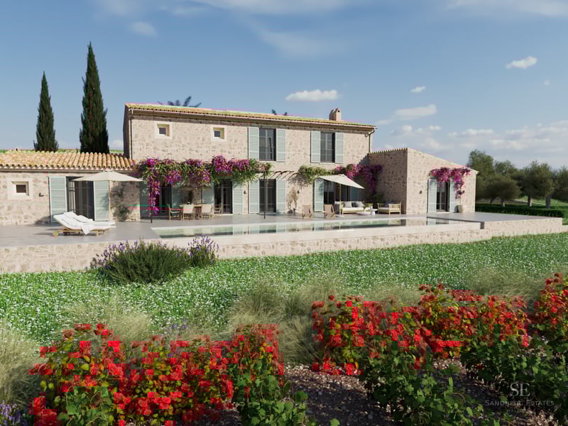 Stone villa featuring a long swimming pool, purple bougainvillea, red roses, and outdoor lounge furniture under a clear sky.