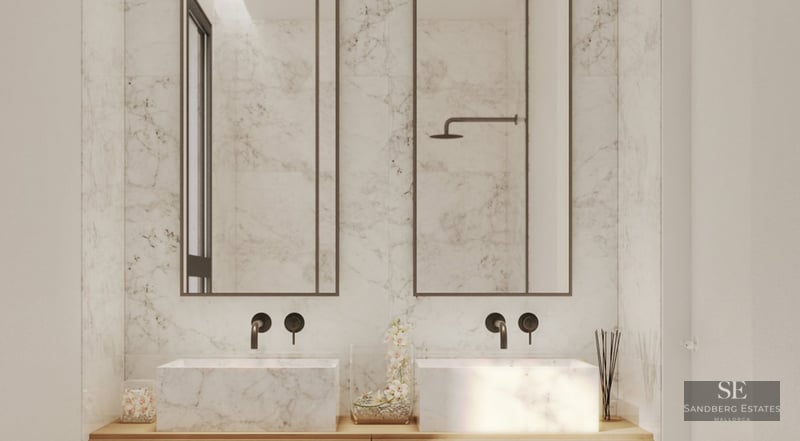 Modern master bathroom with two white marble vessel sinks, matte black wall-mounted faucets, and tall mirrors.