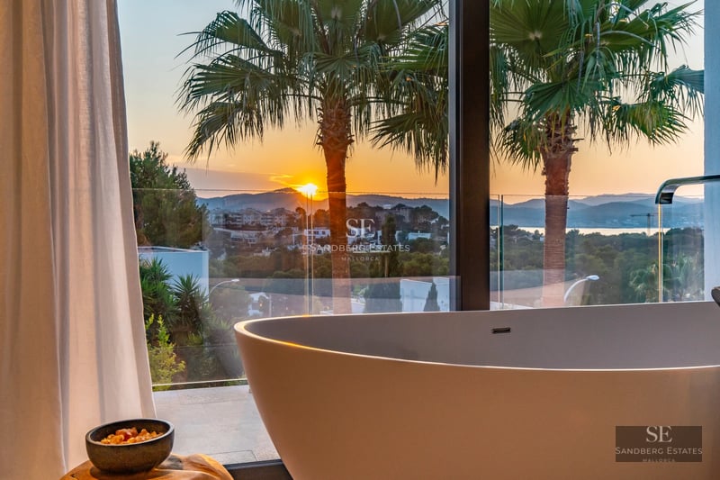 Modern villa exterior featuring a pool, surrounded by greenery. Minimalist architecture with large windows and high-end materials.