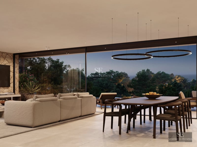 Large pool bordered by an elegant terrace with sun loungers. Modern architecture with large windows and lush vegetation.