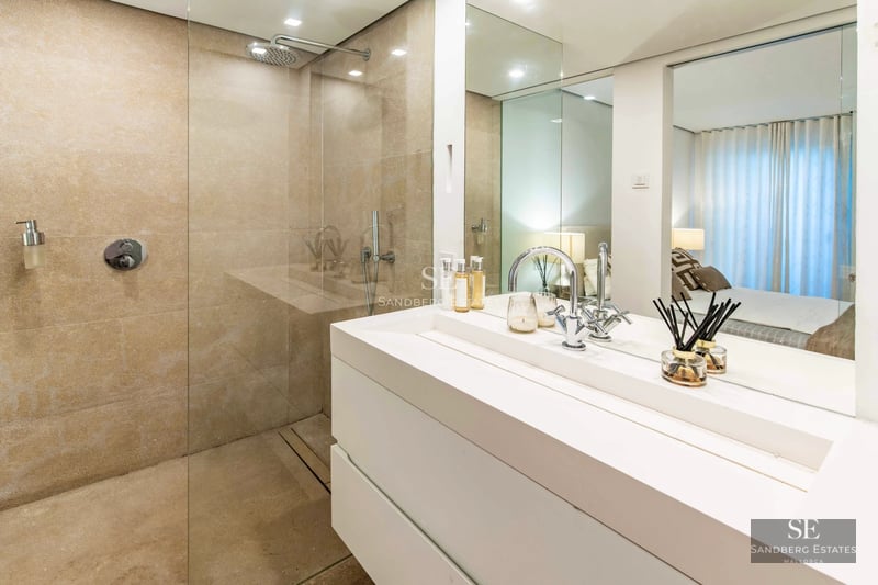 Spacious terrace with infinity pool, sun loungers, and panoramic views. Modern design featuring clean lines and high-end materials.