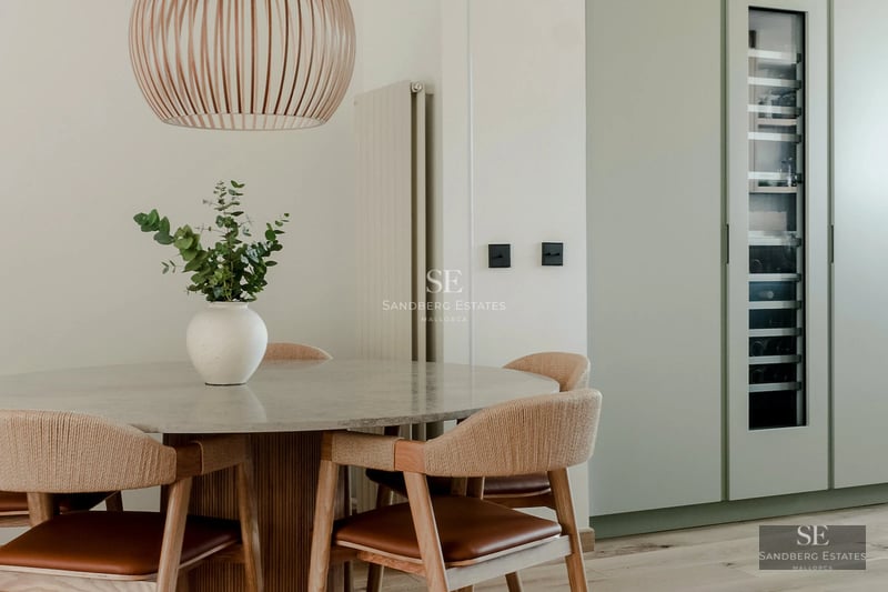 Modern villa featuring an infinity pool, large windows, lush gardens, and minimalist design. Panoramic sea views.