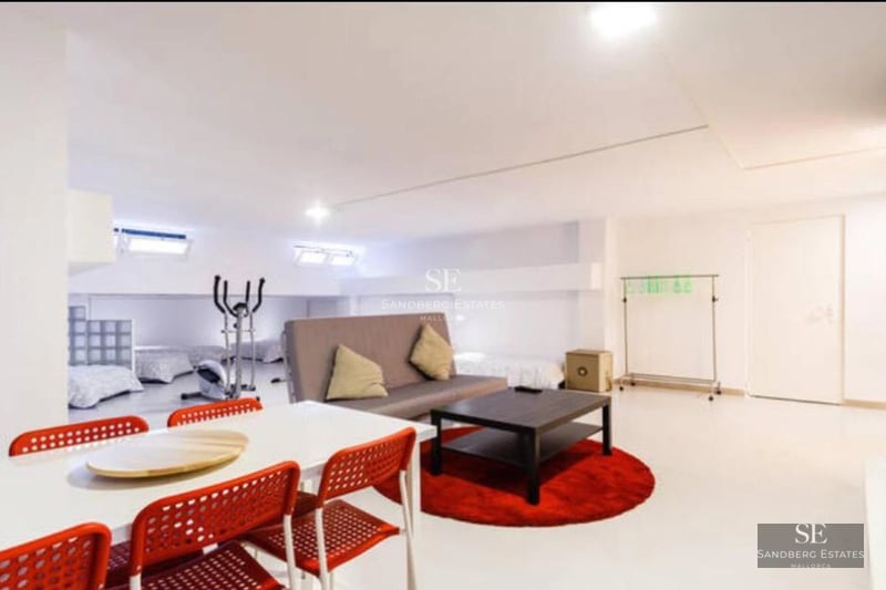 Exterior view of a modern villa featuring a pool, large windows, and lush landscaping. Minimalist architecture and open spaces.