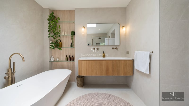 Image of villa with infinity pool, sun loungers, sea views. Modern architecture, clean lines, and high-end finishes.