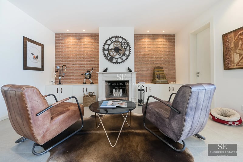 Exterior view of a modern villa with pool, lush garden and large window illuminating the interior. Minimalist design with luxurious finishes.
