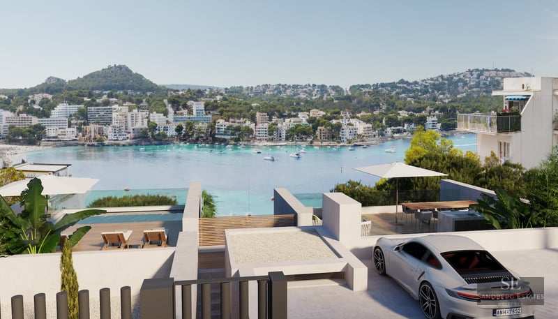 Modern white villa terrace with infinity pool and luxury car overlooking a turquoise bay and coastal hills.