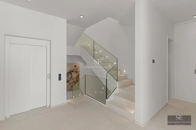 Exterior view of a modern villa with pool, surrounded by lush vegetation. Minimalist and elegant architectural design.