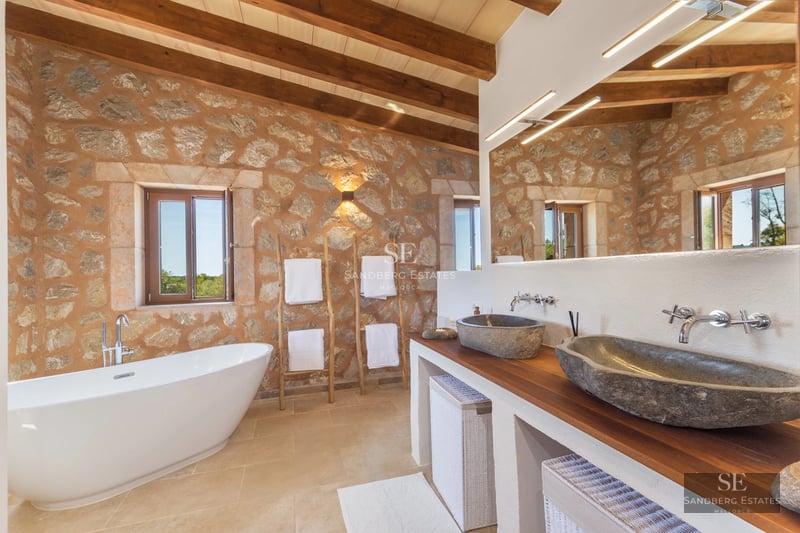 Expansive terrace with infinity pool and sea views. Modern design with elegant furniture and lush vegetation.