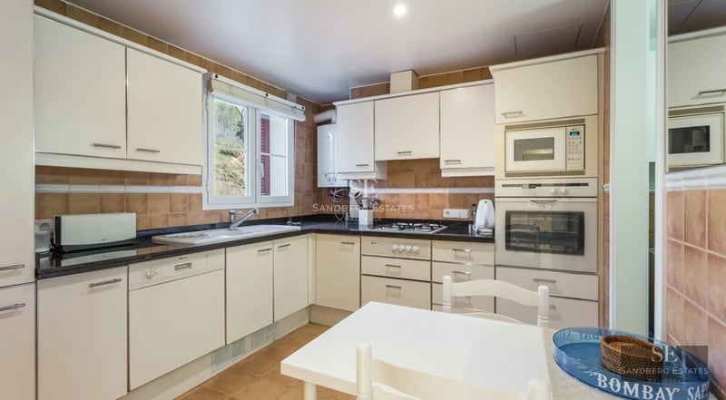 Expansive terrace with infinity pool, modern loungers, and panoramic views. Contemporary architectural design and relaxing atmosphere.