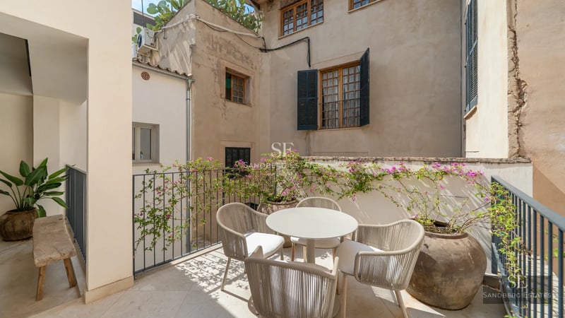 Spacious terrace with infinity pool and panoramic views. Modern, minimalist design with ambient lighting.