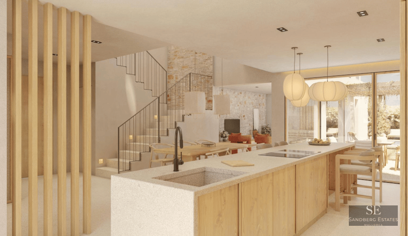 Modern kitchen island with stone sink and wood finishes, integrated with dining area and staircase.